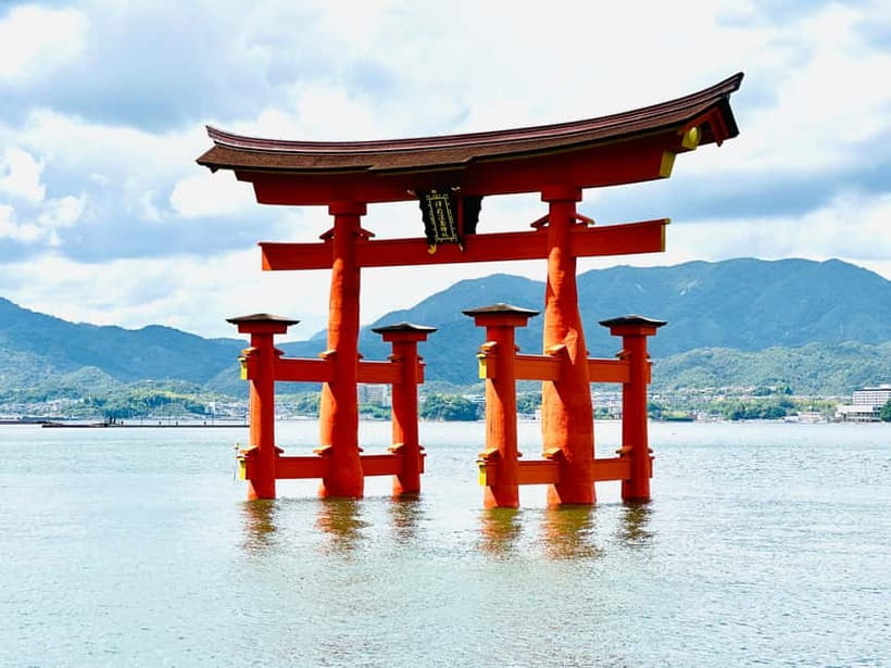 From Osaka: Hiroshima and Miyajima Day Trip by Bullet Train - Miyajima by ferry, with deer and sea views