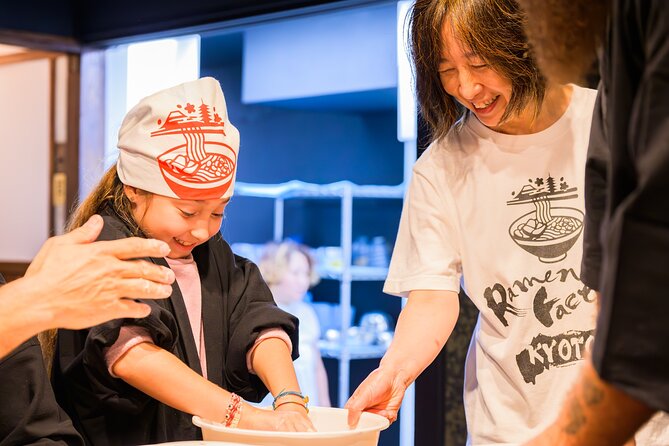 Gyoza Cooking Class in Kyoto: Traditional Japanese Dumplings - Cooking the dumplings with the baking machine