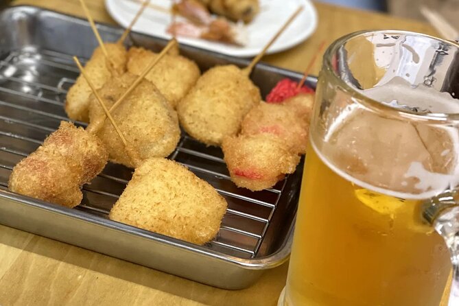 Hidden Osaka - Yukaku Red Light Tour & Culinary Adventure - Entering Tobita Yukaku with respect