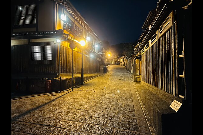 Kyoto: Gion Magical Night Walking Tour - The large Kannon statue and a quiet memorial setting