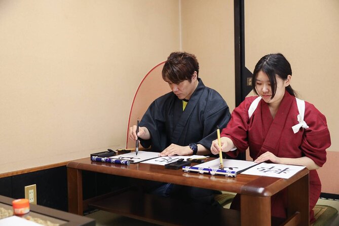 Learning Zen of Japanese Calligraphy in kimono near Osaka Castle - Choosing a kanji character with personal meaning