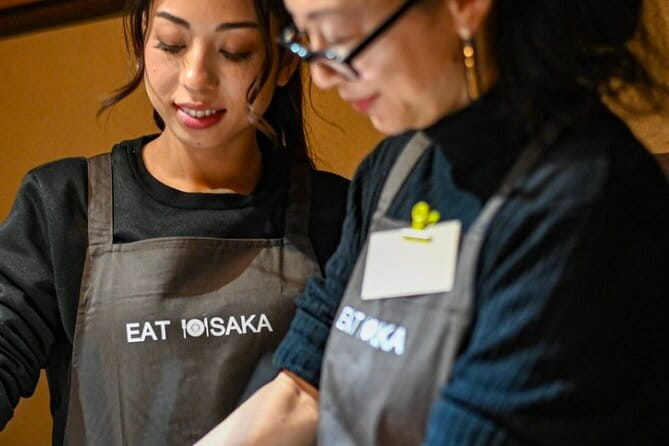 Osaka Cooking Class and Sake Tasting with Local Supermarket Visit - Folding gyoza with practical guidance