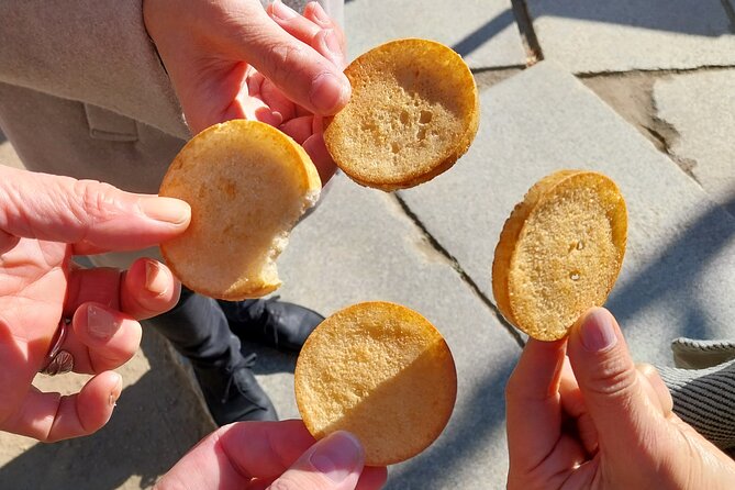 Osaka Food Tour with 10 Classic Japanese Tastings & Drinks - Udon and takoyaki add familiar Osaka comfort