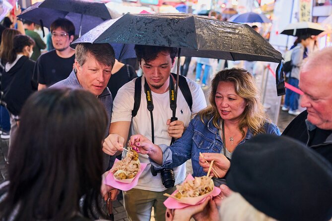 Osaka: Guided Food Tour with 12 Dishes at 4 Local Eateries - Fresh fish, grilled skewers, and changing menus