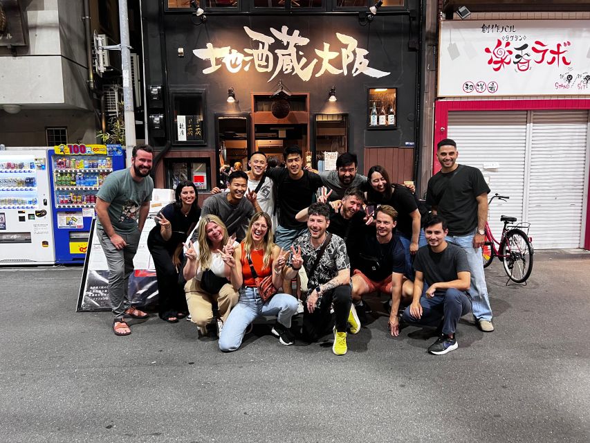 Osaka: Izakaya Bars Guided Walking Tour - Starting beneath the Dotonbori neon