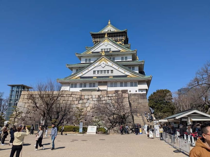 Osaka: Osaka Castle Guided Tour with Local Guide - The massive stone walls and castle defenses
