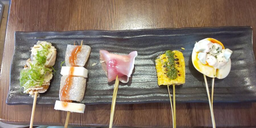Osaka: Shinsekai Food Tour with 13-15 Dishes at 5 Eateries - Stop three: a traditional restaurant for nikudoufu and homestyle plates