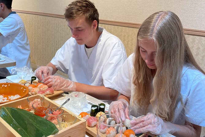 Osaka Sushi Making Class – Hands-On Nigiri & Rolls (Same-Day OK) - Rolling sushi and enjoying the finished meal