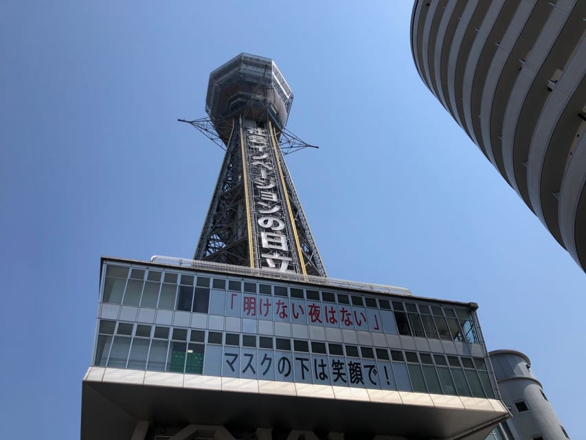 Osaka: Tsutenkaku Tower Entry Ticket - Neon lights and the tower’s changing mood