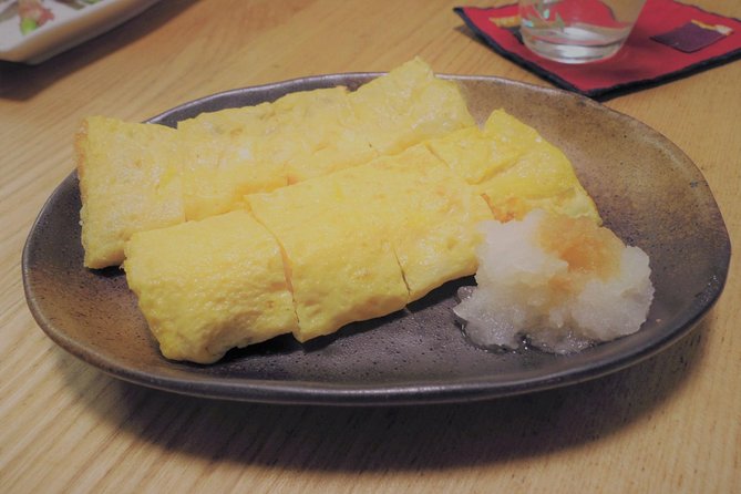 Private Japanese Cooking Class in Hiroshima with Machiko's Family - Sitting down with Machiko, Daishi, and the family