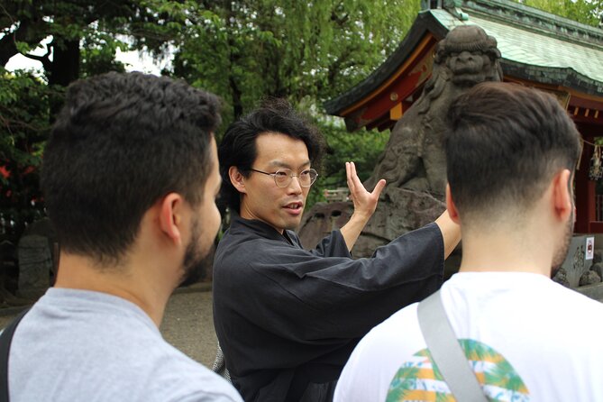 Tokyo: Asakusa Walking Tour with Japanese Comedian - The quiet statues at Senso-ji