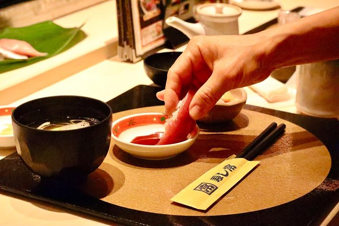 Tokyo: Food Tour in Ueno with 10+ Tastings of Japanese Classics - Eating Beneath the Elevated Train Tracks