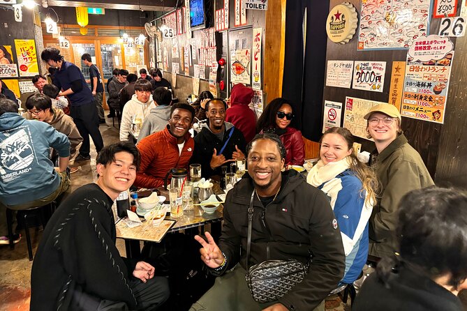 Tokyo: Shibuya Authentic Food Tour & Local Delights - Meeting Hachiko and crossing into Center-gai