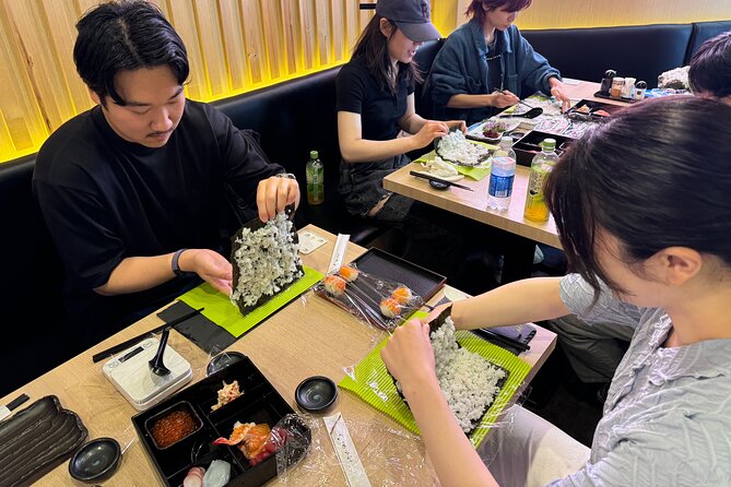 Tokyo Sushi Making Experience & Japanese Cooking Class - Shaping temari sushi into small edible rounds